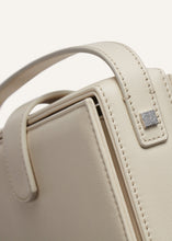 Load image into Gallery viewer, Apolonia bag in cream leather with flower charm