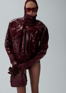 Vintage patent leather bomber jacket in bordeaux