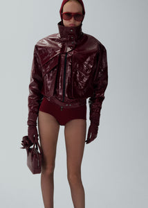 Vintage patent leather bomber jacket in bordeaux