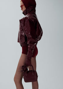 Vintage patent leather bomber jacket in bordeaux