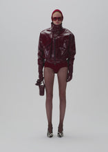 Load and play video in Gallery viewer, Vintage patent leather bomber jacket in bordeaux
