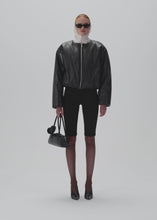 Load and play video in Gallery viewer, Collarless puffer jacket in black leather
